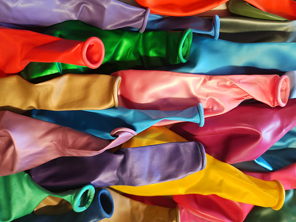 Image is of a selection of  deflated balloons from Acting the Part, a balloon shop in Carlingford, Sydney.